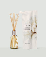 Oceanique fragrance diffuser with reeds and matching refill pouch.