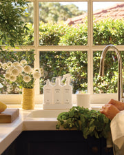 White Tea & Wild Mint Kitchen Trio styled beside a kitchen sink