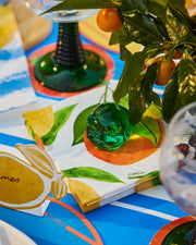 Summer paper cocktail napkins with an orange, green leaves and small floral details.