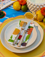 Summer paper dinner napkins with a colourful citrus, green leaf and floral print.