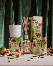 White Fig & Cedar candle, diffuser and Tree Scent Stems styled with botanical gift boxes and Christmas decorations.