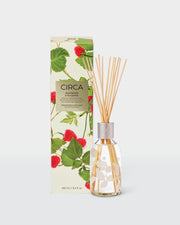 Raspberry & Rhubarb 250ml Fragrance Diffuser with natural fibre reeds beside its front-facing raspberry-print box.