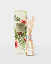 White Fig & Cedar 250ml Fragrance Diffuser with natural fibre reeds beside its front-facing botanical gift box.